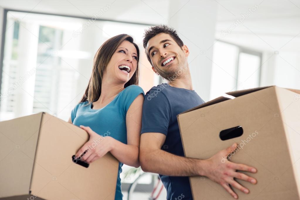 depositphotos 124532752 stock photo happy couple moving in their